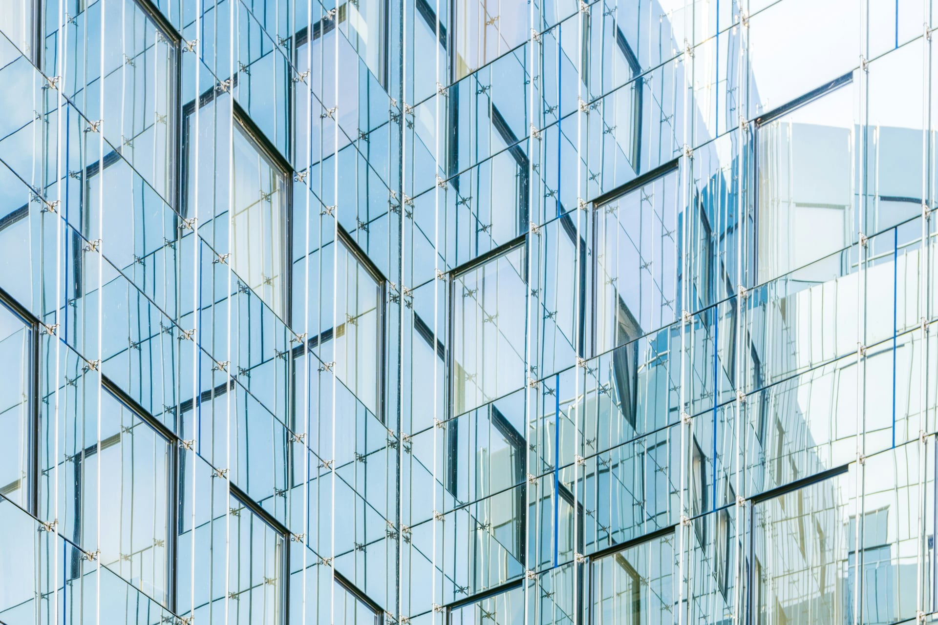 Glass building facade with cool blue reflections
